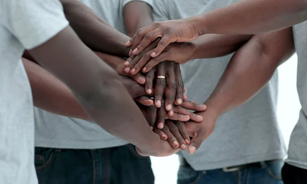 Close up. a multi-ethnic group of friends showing their unity — 스톡 사진