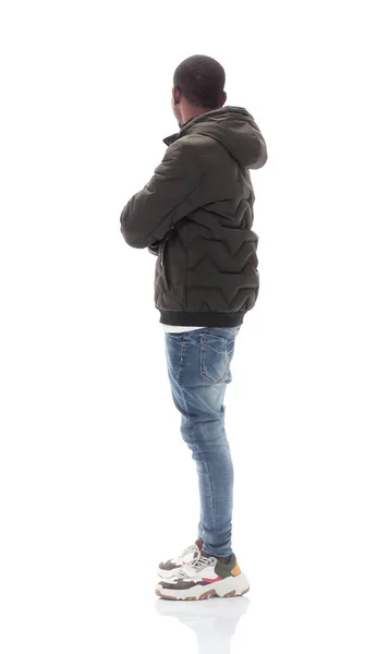 Vista lateral. chico casual en jeans mirando espacio de copia —  Fotos de Stock