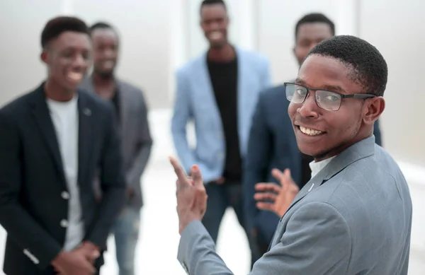 Young businessman pointing to his business team — Stock Photo, Image