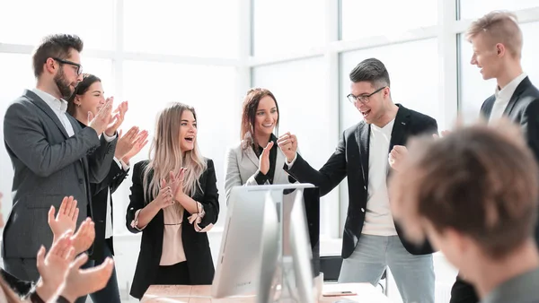 Boss and happy employees applaud standing in the office — 스톡 사진