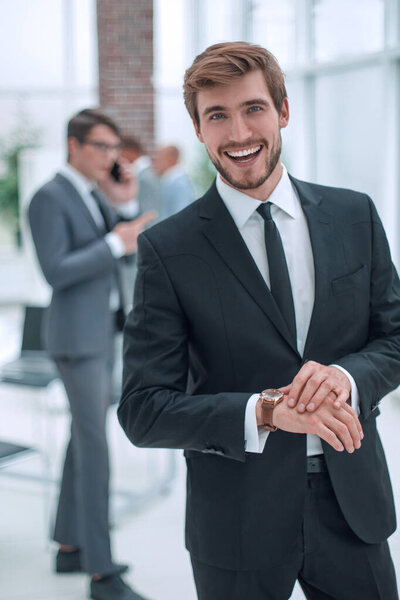 smiling business men standing in the office