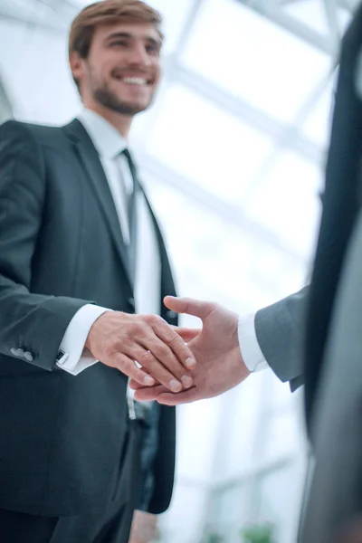 Image of business people holding out their hands for a handshake. — Stock Photo, Image
