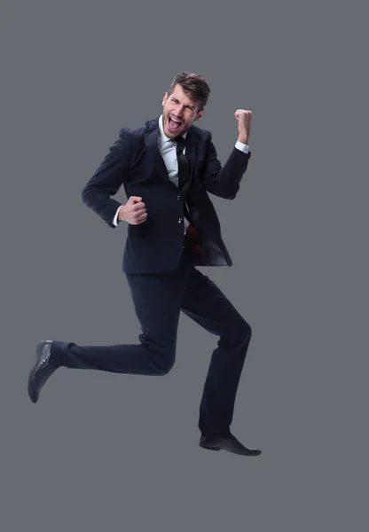 En pleno crecimiento. feliz joven hombre de negocios. aislado en blanco — Foto de Stock