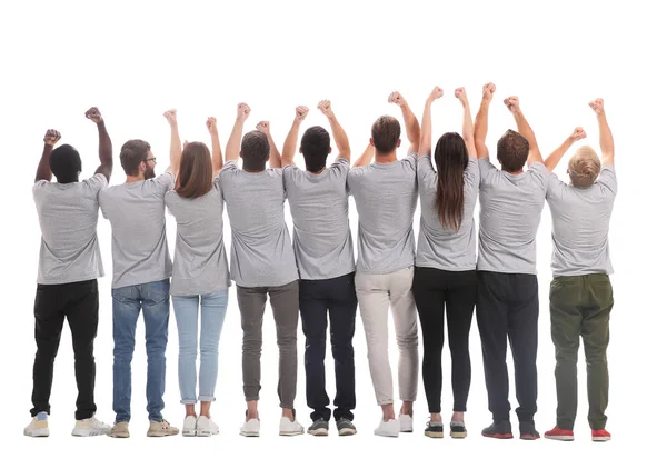 Rückansicht. eine Gruppe junger Gleichgesinnter, die ihre Hände in die Höhe halten — Stockfoto