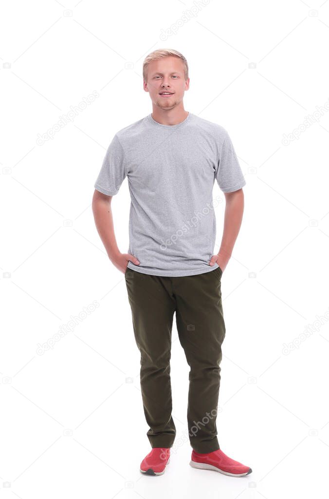 in full growth. confident guy in jeans and a t-shirt