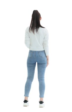 Dikiz aynası. Beyaz bir duvarın önünde duran kotlu şık kız..