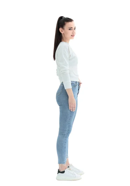 Vista laterale. elegante giovane donna in jeans e camicetta bianca — Foto Stock