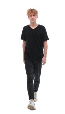 in full growth. stylish young man striding forward.