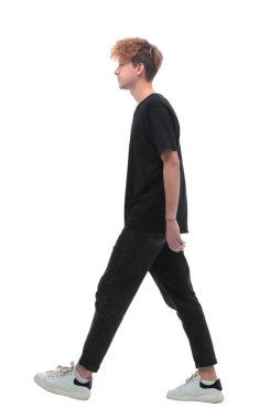 side view. stylish young man confidently moving forward
