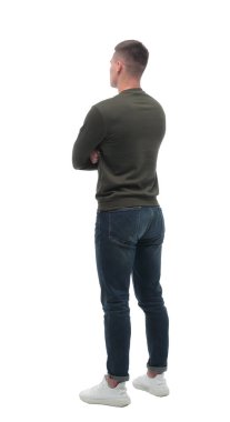 Yan görünüş. ciddi genç adam boş beyaz ekrana bakıyor. .