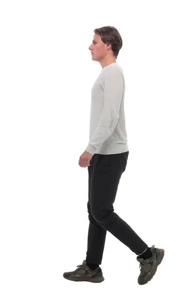 Side view . modern young man stepping forward — Stock Photo, Image