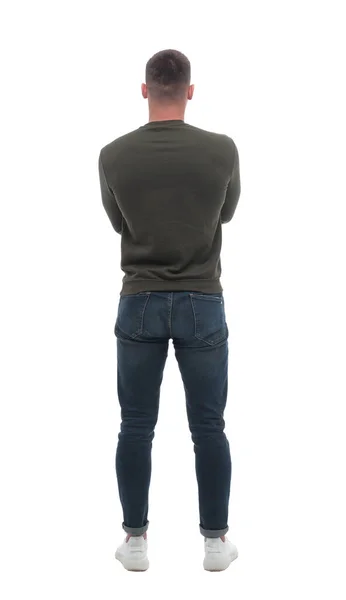 Vista posteriore. un giovane maschio in piedi davanti a uno schermo bianco vuoto — Foto Stock