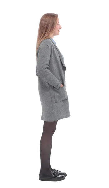 Vista lateral. uma jovem mulher em um casaco cinza . — Fotografia de Stock