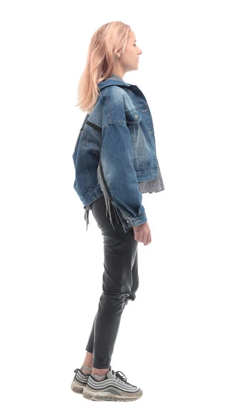 Вид сбоку. случайная девушка в джинсовой куртке с нетерпением ждет — стоковое фото