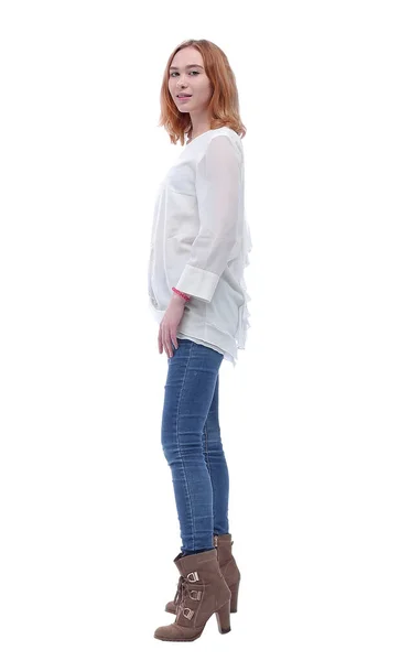 Vista lateral. mulher jovem na moda confiante em jeans e botas altas — Fotografia de Stock