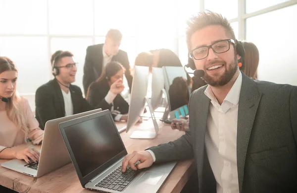 Call center consultant at the workplace in the office — Stock Photo, Image