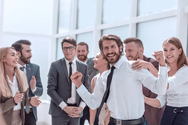 Corporate group of employees congratulating each other on the victory — Stock Photo, Image