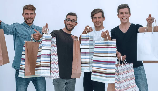 Paper bags in the hands of a team of friends — Stock Photo, Image