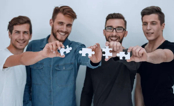 Image of the guys connecting pieces of the puzzle — Stock Photo, Image