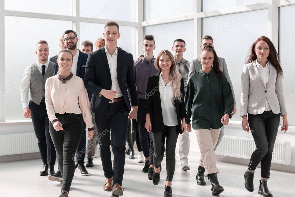 young business people walking together in a new office