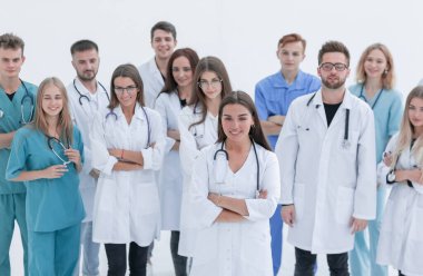 Bir grup tıp uzmanı liderlerini alkışlıyor.