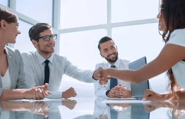 Young business partners shaking hands — Stock Photo, Image