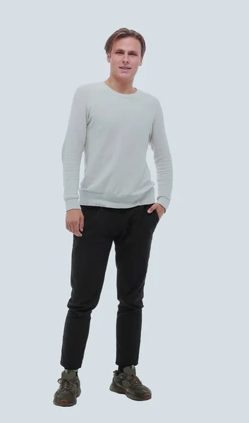 In volle groei. stijlvolle jongeman in witte longsleeve. — Stockfoto