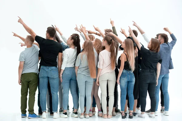 Bakifrån view.a grupp unga likasinnade människor pekar framåt . — Stockfoto