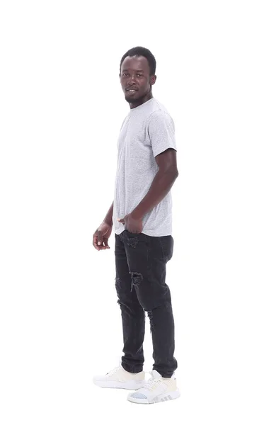 Vista posteriore. giovane uomo in piedi davanti al muro bianco — Foto Stock