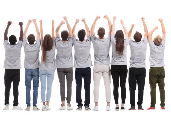 Вид ззаду. група молодих однодумців тримає руки вгору — стокове фото