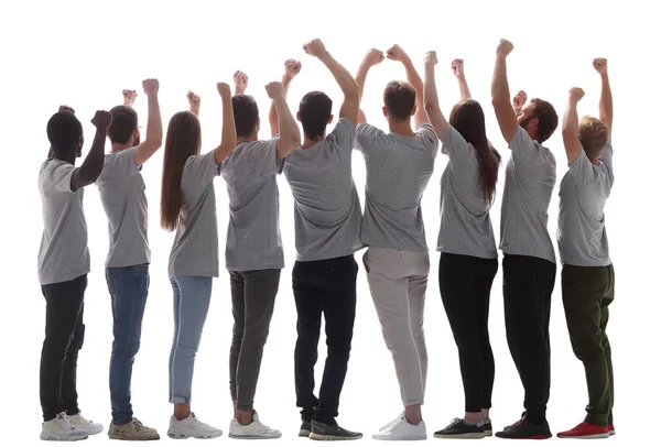 Zadní pohled. skupina šťastných mladých lidí s rukama nad hlavou — Stock fotografie