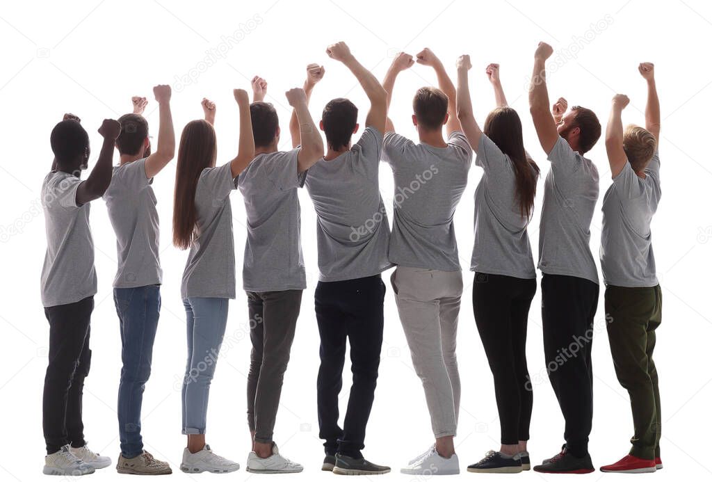 rear view. group of happy young people with hands up