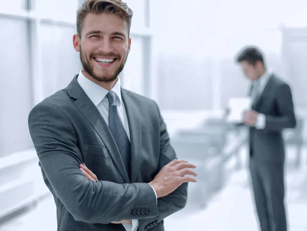 Successful businessman on the background of the office — Stock Photo, Image