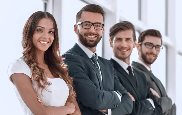 Successful business team standing in a bright office — Stock Photo, Image