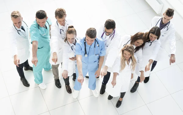 Top view. large group of medical professionals pointing ahead. — Stock Photo, Image