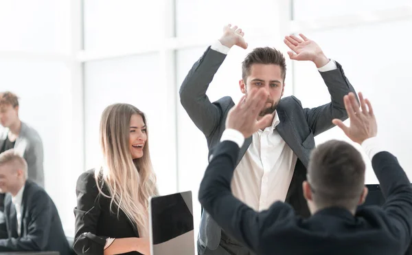 happy employees giving each other a high five.