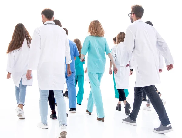 Visão traseira. um grupo de paramédicos marchando para ajudar — Fotografia de Stock