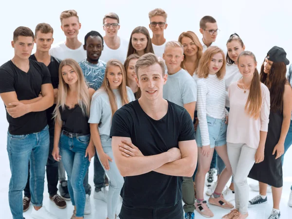 confident guy standing in front of a group of young people