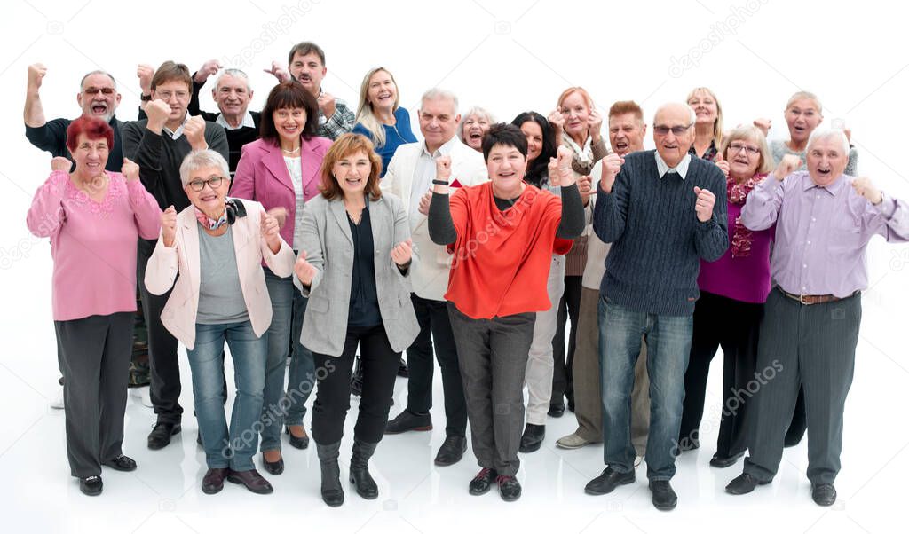 Group of senior people raising their hands celebrating a victory