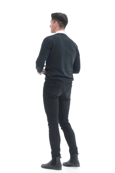 Vista posteriore. giovane uomo in piedi davanti a uno schermo bianco — Foto Stock