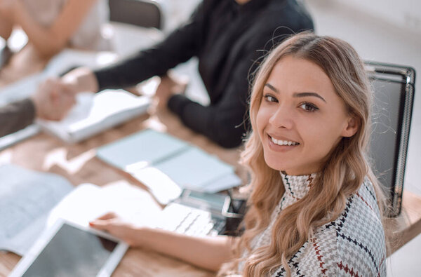 young business woman with a digital tablet at a business meeting