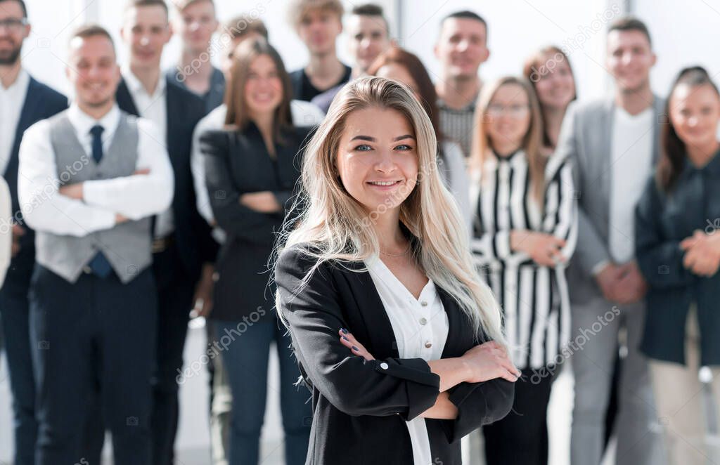 ambitious young business woman standing in front of her colleagues