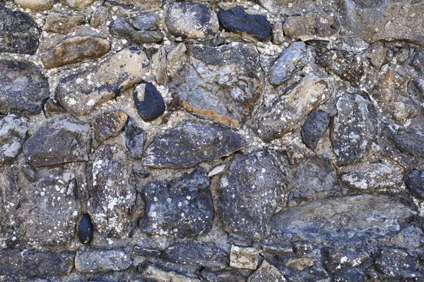 Fondo de pared de piedra con mucha textura — Foto de Stock
