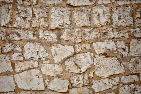 Parte de un muro de piedra. Fondo o textura — Foto de Stock
