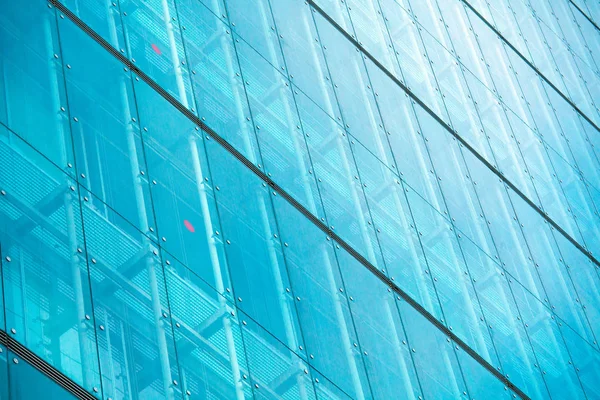 Modern glass silhouettes on modern building — Stock Photo, Image