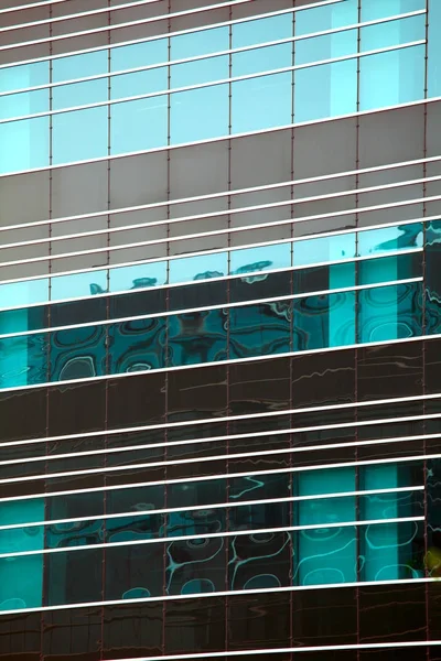 Modern glass silhouettes on modern building — Stock Photo, Image