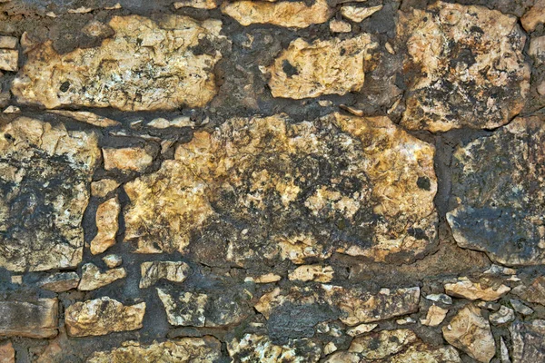 Pared de piedra decorativa áspera para un fondo — Foto de Stock