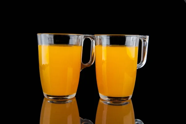 Orange juice - two glasses with oranges on black background — Stock Photo, Image