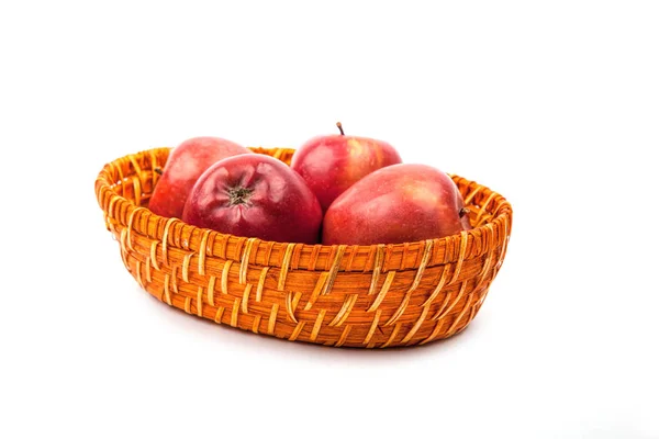 Many apples in the basket close up on a white — Stock Photo, Image