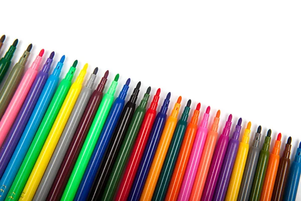 Багато різнокольорових маркерних ручок ізольовано на білому тлі Ліцензійні Стокові Зображення
